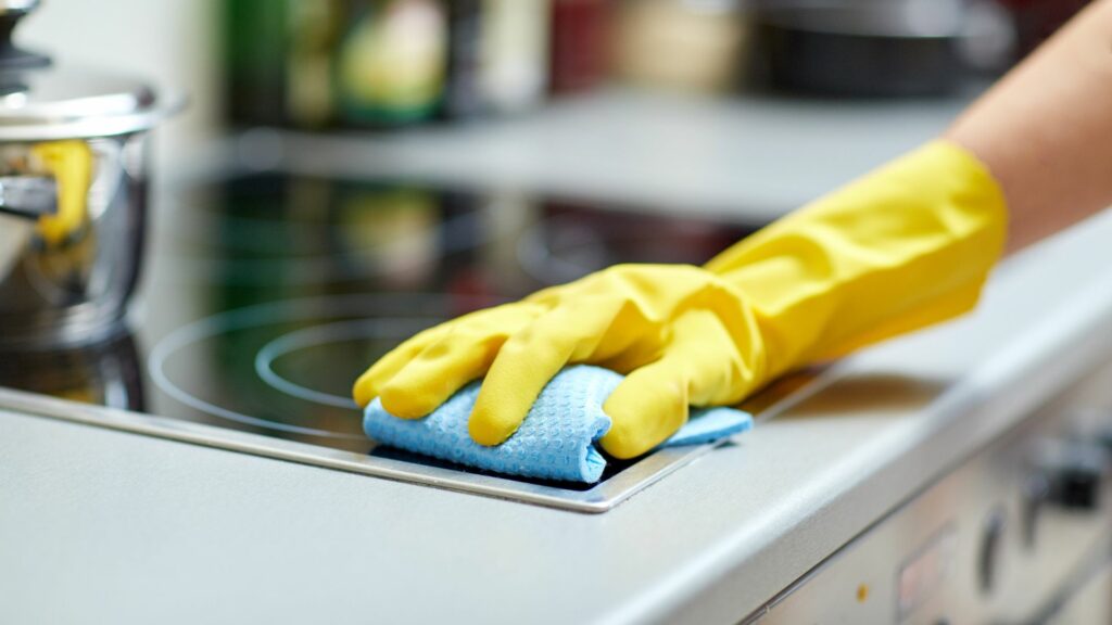 Stovetop being cleaned